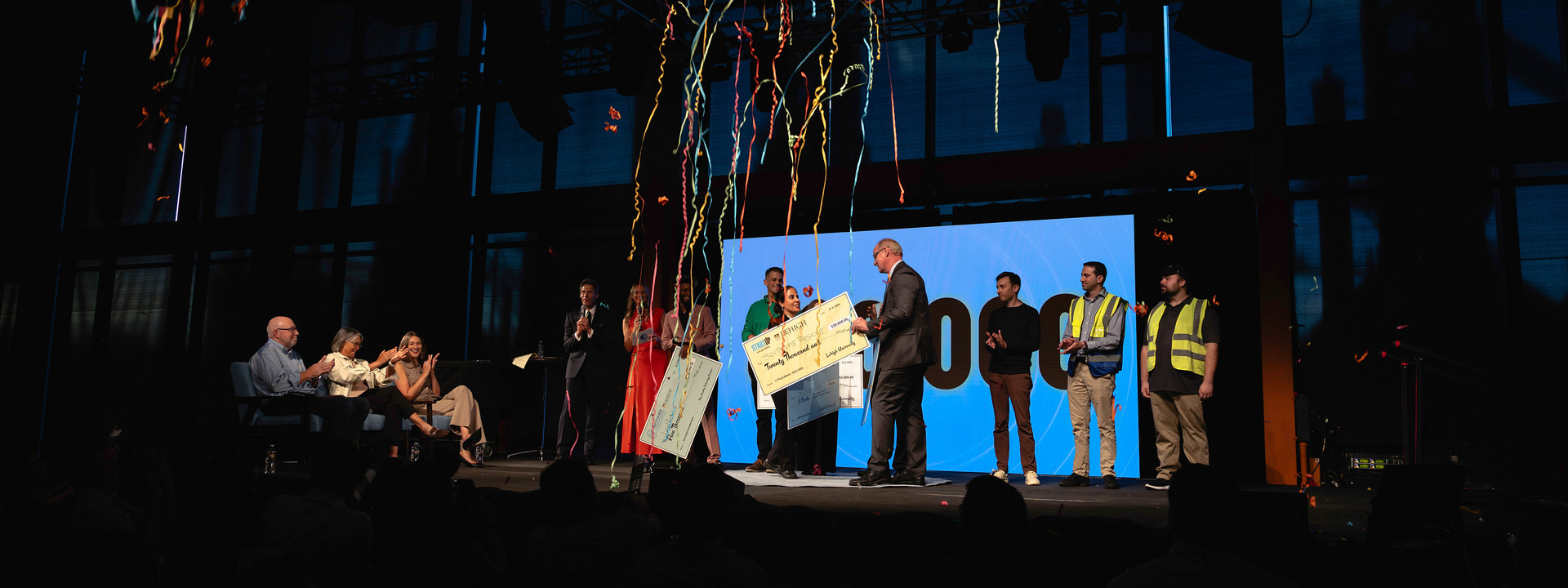 confetti falls as SkyPreme Resolve is presented the grand prize check at  StartUp Lehigh Valley 