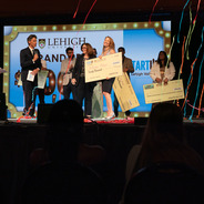 StartUp Lehigh Valley 2025 Winner holding a large check and surrounded by streamers